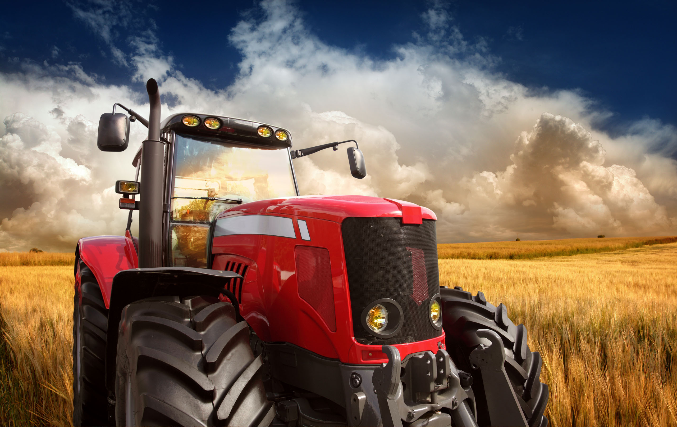 New Modern Tractor on the Barley Field in Sunset Light, Photomontage. See more pictures from my lightbox 